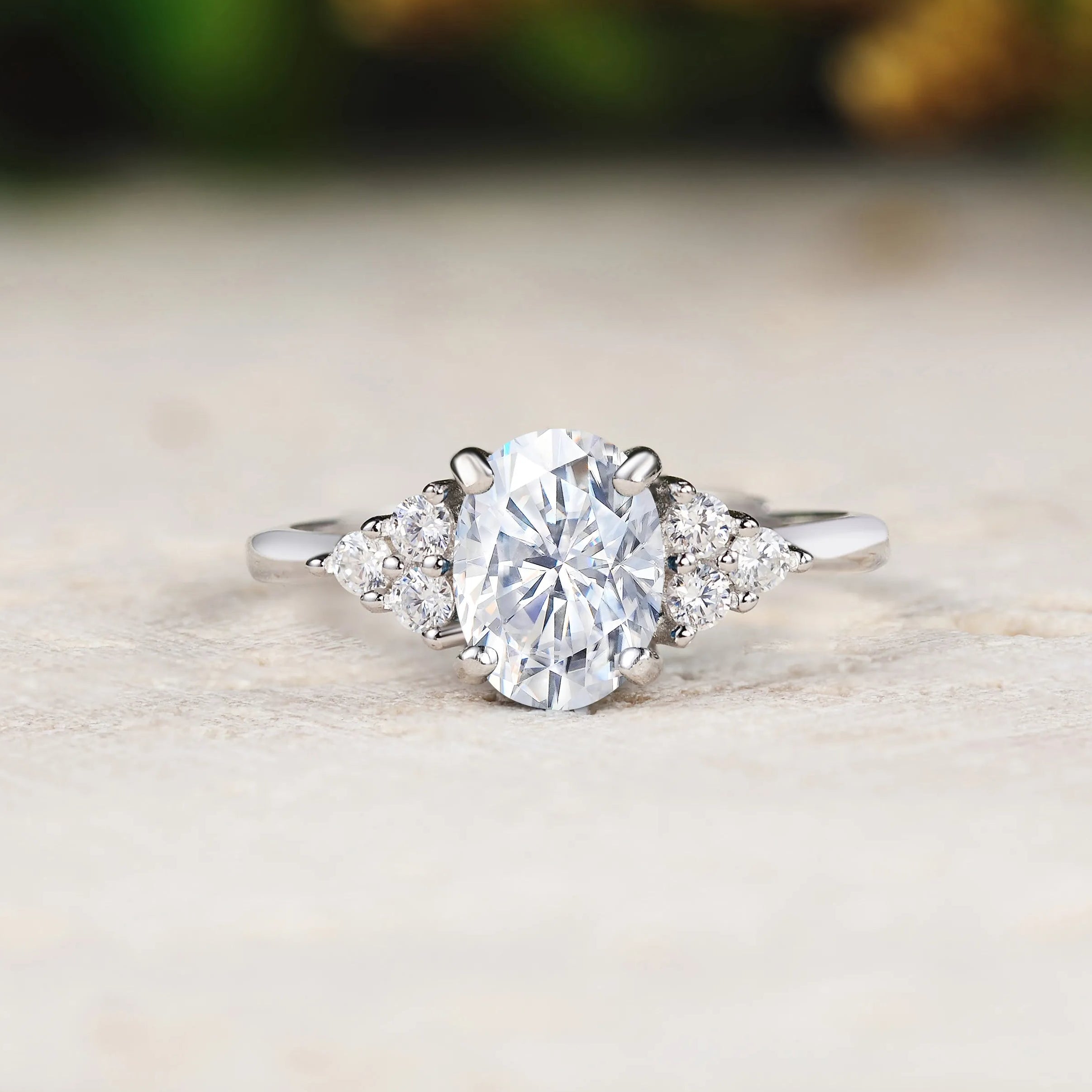 Diamond ring on a light wooden surface with a blurred natural background