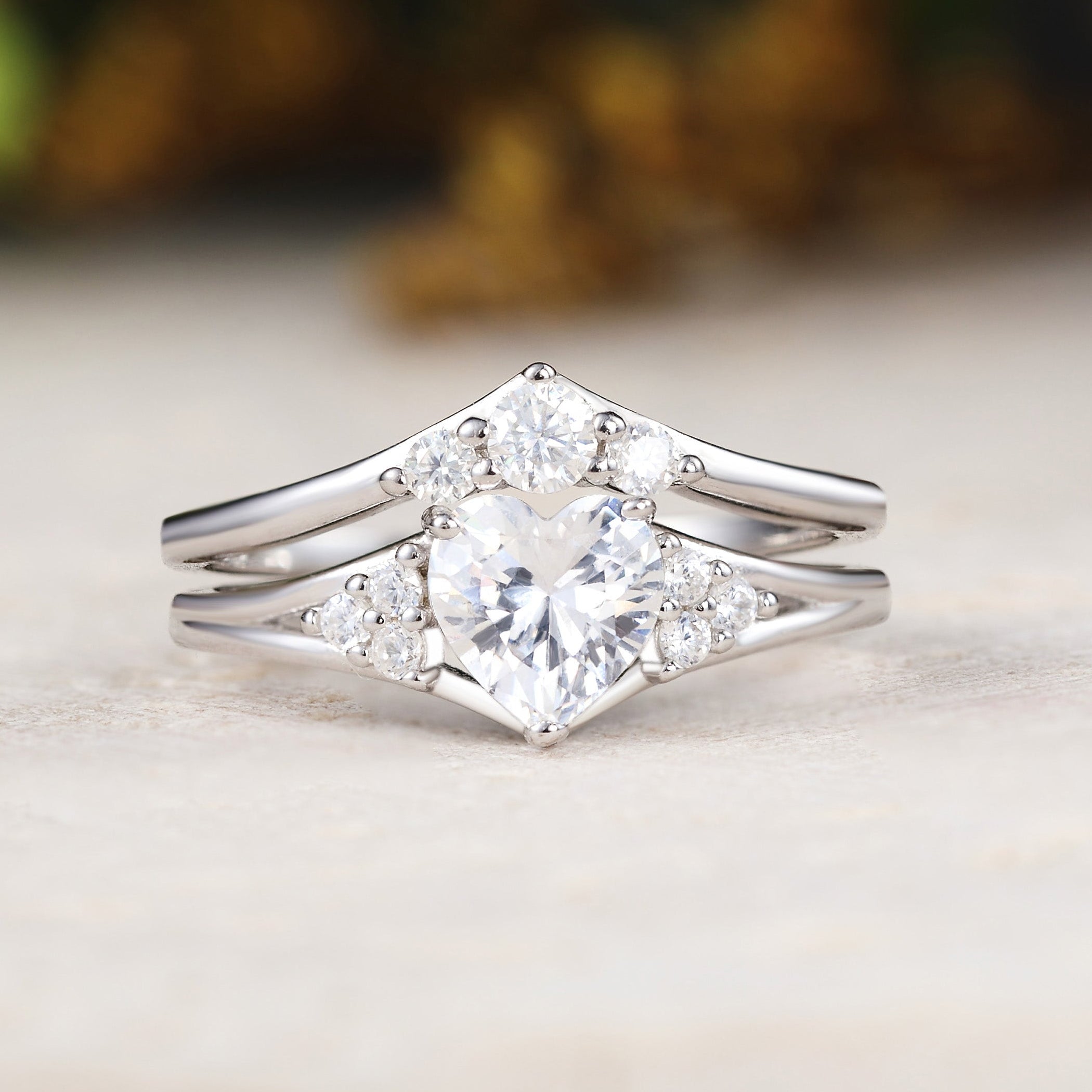 Silver ring with diamond accents on a light surface