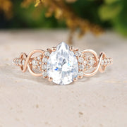 Rose gold ring with a large diamond on a neutral background
