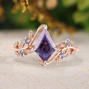 Rose gold ring with purple gemstone and small diamonds on a natural background