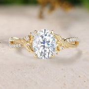 Gold ring with a large diamond on a beige surface